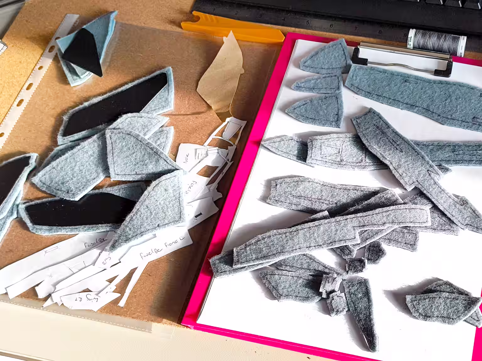 Fabric panels and pattern pieces laid out about to be sewn together